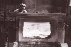 Historical photo of a foundry worker in the CXM plant.